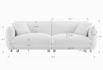A lovable, fat, bread-like sofa with 2 pillows and metal feet with anti-skid pads